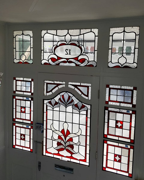 A classic stained glass frontage in bright red with clear textures.
